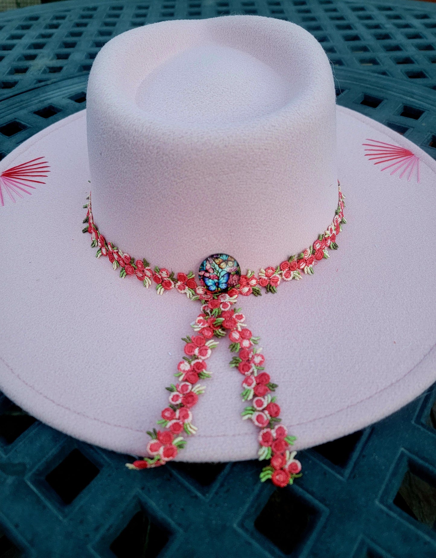 Pretty in Pink. 🩷 
Pink fedora hand embroidered with pink highlights. Pink floral band with butterfly pin accent on the back. 
$100. This would also make a cute mommy and mini set! #prettyinpink #pinkfedora #handembroideredfedora #pinkfedora